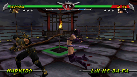 Mortal Kombat: Unchained (PSP) screenshot: Scorpion pulling Li Mei.