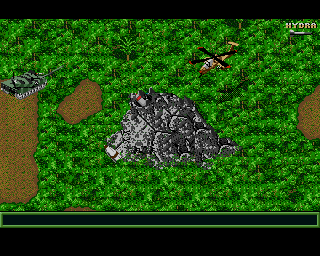 Jungle Strike (Amiga) screenshot: Level 8 - A tomahawk missile hidden in a mountain and a tank.