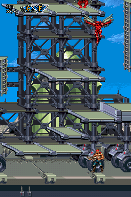 Contra 4 (Nintendo DS) screenshot: Just when you thought the stage should be about over, a giant rocket pops out of the ground, and scaffolding gets pushed from off-screen.
