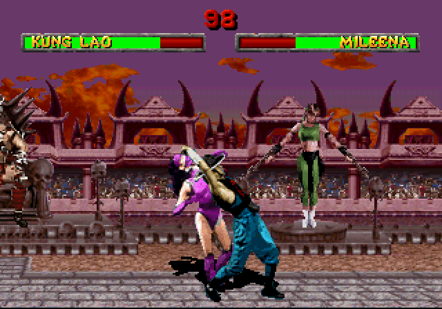 Mortal Kombat II (SEGA Saturn) screenshot: Kung Lao aims Mileena at Sonya