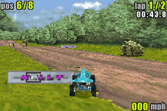 ATV: Quad Power Racing (Game Boy Advance) screenshot: Hitting the sign will knock you off your quad.