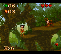 Disney's The Jungle Book (SNES) screenshot: The monkeys throw fruit. You can shoot them or land on them.