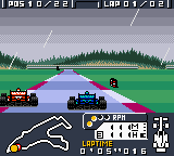 F-1 World Grand Prix (Game Boy Color) screenshot: Passing a gaudy red car.
