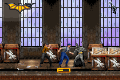 Batman Begins (Game Boy Advance) screenshot: Fighting in a warehouse.