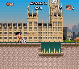 Soccer Kid (SNES) screenshot: Each city features distinct sights.