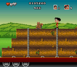 Soccer Kid (SNES) screenshot: This squirrel guards a stack of lumber.