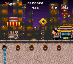 Soccer Kid (SNES) screenshot: New York - skyline, hot dog stand and yellow cab