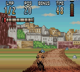 Supercross Freestyle (Game Boy Color) screenshot: A sudden turn in a quaint Italian road