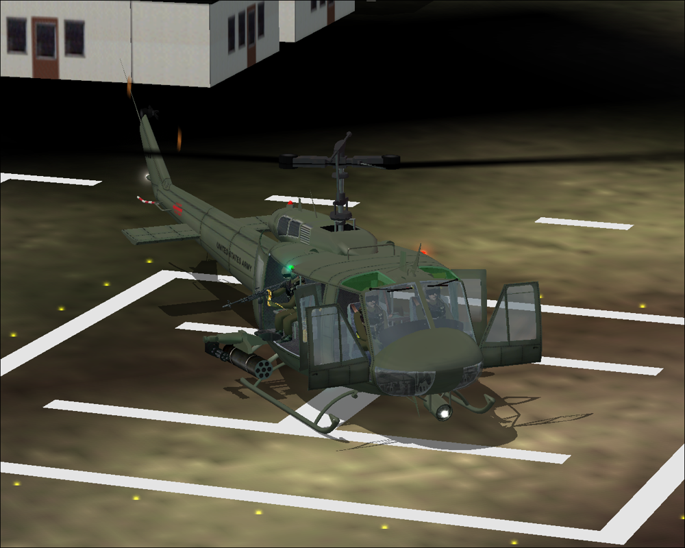 Military Helicopters (Windows) screenshot: FS9- Huey: Sitting on the included US Army helipad in Vietnam. Front and rear doors open.