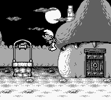 The Smurfs' Nightmare (Game Boy) screenshot: Jumping in front of houses.