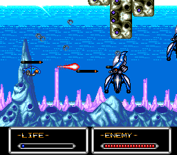 Shockman (TurboGrafx-16) screenshot: Attacking large, squid-like enemies with a charged shot