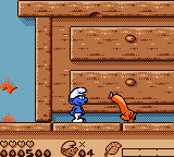 The Smurfs' Nightmare (Game Boy Color) screenshot: Walking sausage in the kitchen