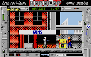 RoboCop (Atari ST) screenshot: Firing a triple-shot against a grenade-hurling assailant taking cover behind destructable crates