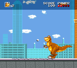 We're Back!: A Dinosaur's Story (SNES) screenshot: Throwing stones.