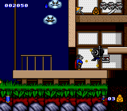 Impossamole (TurboGrafx-16) screenshot: Throwing a box at a camera while the clouds attack with rain