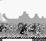 Joe & Mac: Caveman Ninja (Game Boy) screenshot: You have to make your way through cavemen and dinosaurs.