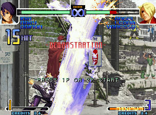 The King of Fighters 2002: Challenge to Ultimate Battle (Neo Geo) screenshot: Demonstration Match crucial moment: Iori Yagami "detonating" Angel with his Ura 316 Shiki: Saika...
