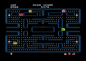 Pac-Man (Atari 8-bit) screenshot: Pac-Man munches on some dots...