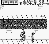 Wizards & Warriors X: Fortress of Fear (Game Boy) screenshot: Attacking a skeleton