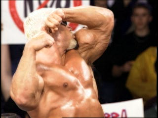 WCW Backstage Assault (PlayStation) screenshot: Showing off his guns to the crowd.