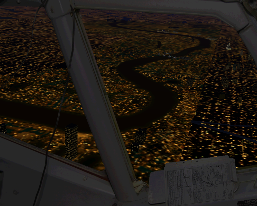 737-400: Greatest Airliners - Special Edition (Windows) screenshot: The Thames at night, left view from cockpit. Circling back to Heathrow. This is a 2D view; no 3D cockpit in this addon.