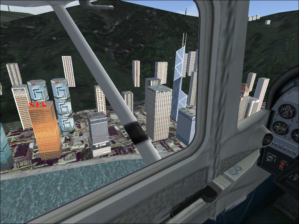 Hong Kong for Microsoft Flight Simulator 2004 (Windows) screenshot: Some non-square buildings to be seen here and there.