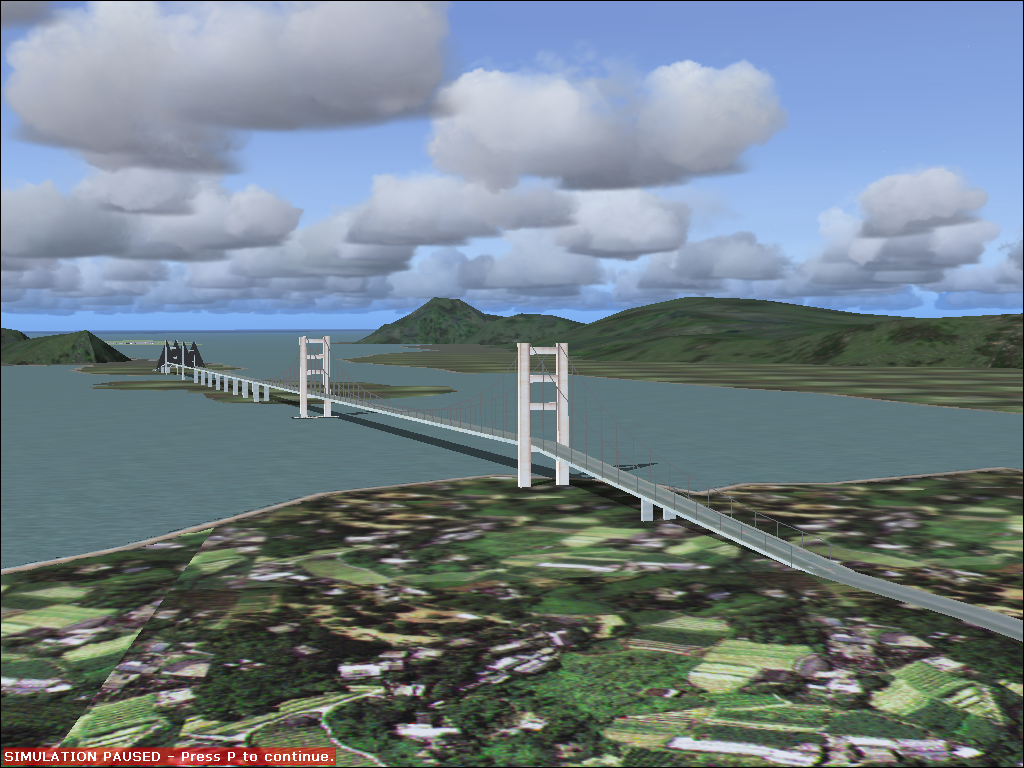 Hong Kong for Microsoft Flight Simulator 2004 (Windows) screenshot: This is the bridge leading to the island with the new VHHH airport. The closeness prevents AI traffic on both airports, the approaches would interfere.