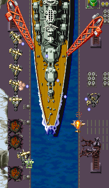 1941: Counter Attack (Arcade) screenshot: Destructible Building and Ships Background