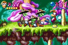 Rayman: 10th Anniversary (Game Boy Advance) screenshot: Rayman is ready to use his punch against a group of both Tall and Small Livingstones!