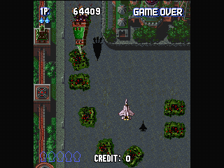 Sonic Wings Special (PlayStation) screenshot: Stage 8 - The Red Square. Just peacefully overflowing the city for a change of pace.
