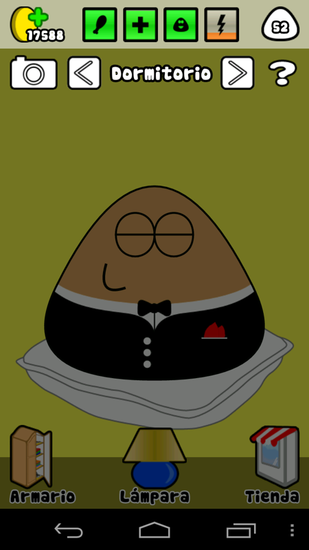 Pou (Android) screenshot: His bedroom has a lamp and you can put to sleep Pou by turning off the lamp when he's tired.