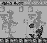 Gremlins 2: The New Batch (Game Boy) screenshot: The first boss throws tomatoes.