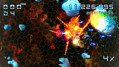 Super Stardust Portable (PSP) screenshot: A lava planet with a lot of ice on the orbit