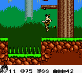 Turok 2: Seeds of Evil (Game Boy Color) screenshot: Dodging bullets while carrying a gatling gun. (Game Boy Color)