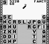 Wordtris (Game Boy) screenshot: Dynamite removes three letters.