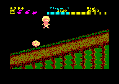 Wonder Boy (Amstrad CPC) screenshot: This is what happens when you smash into a rolling boulder or other obstacle: you lose a life