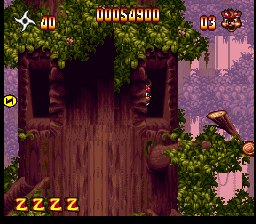 Zero the Kamikaze Squirrel (SNES) screenshot: Large trees in the forest level