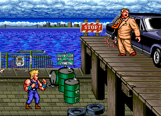 The Combatribes (Arcade) screenshot: The fat man...