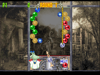 Bust-A-Move 4 (PlayStation) screenshot: Lots of bubbles on each side of the pulley.