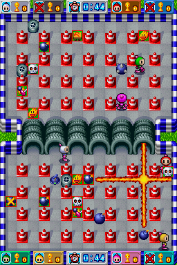 Bomberman (Nintendo DS) screenshot: When a player dies, he'll leave all his power ups scattered on the battlefield.