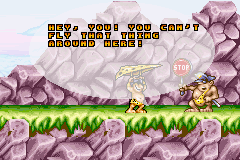 Prehistorik Man (Game Boy Advance) screenshot: I got to the top of the other side of the canyon but I need 15 diamonds to pass.