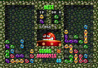 Dr. Robotnik's Mean Bean Machine (Genesis) screenshot: The right screen if your computer opponent, who will throw onto your screen gray "refugee" beans from time to time. Such beans can't be grouped, unlike the colored ones, and make the game more difficult than a usual Tetris