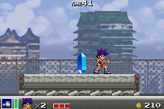 Goemon: New Age Shutsudō! (Game Boy Advance) screenshot: The crystal marks the end of the stage and brings forth a fountain of coins when smashed.