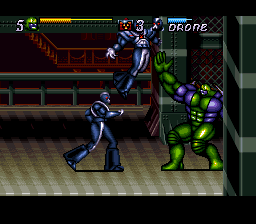 Jim Lee's WildC.A.T.S: Covert Action Teams (SNES) screenshot: Maul will toss enemies up in the air after grabbing them so that he can punch them. This is just show-boating though, and actually deals less damage than Spartan or Warblade's throws.