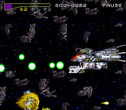 Chō Jikū Yōsai Macross: Scrambled Valkyrie (SNES) screenshot: Dodging the big ship's weapons