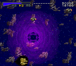 Chō Jikū Yōsai Macross: Scrambled Valkyrie (SNES) screenshot: This black hole will try to suck you into it