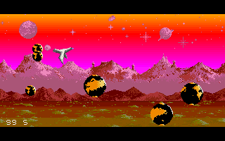 Sophelie (Amiga) screenshot: Large planets eject smaller planets to destroy you.