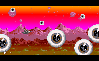 Sophelie (Amiga) screenshot: These giant eyeballs have the reflection of the grim reaper holding a scythe in them.