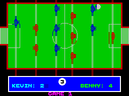 Pub Games (ZX Spectrum) screenshot: Table Football : Game in progress. The ball's at the top on the right and the blue player is going to miss it