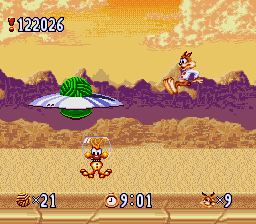 Bubsy in: Claws Encounters of the Furred Kind (SNES) screenshot: This boss flying saucer drops woolies this time